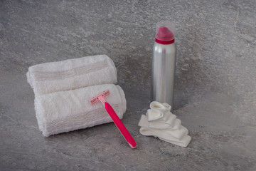 cosmetic packaging set on grey background. facial beauty cosmetic products. Shaving foam and spa towels