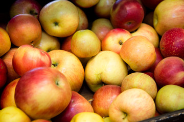 ripe red apples on the counter in the supermarket