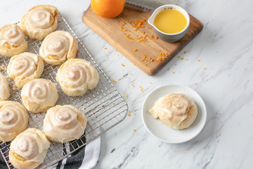 Freshly Baked Homemade Orange Rolls on Kitchen Counter