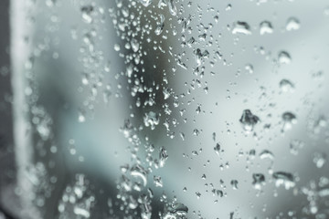 Many small drops of water on the car window