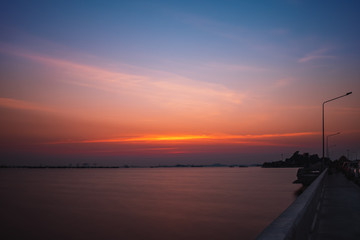 Obraz na płótnie Canvas colorful sunset over port and sea