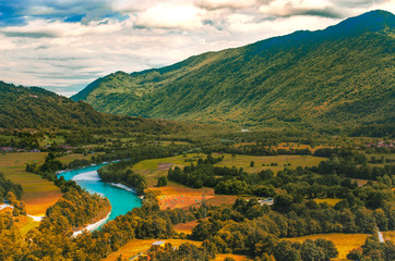 Isonzo Soca river valley  yellow teal and orange sunset landscape in  Slovenia - Italy border