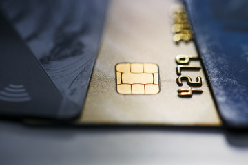 Selective focus microchip on paying by credit card or credit gold card for background. Contactless...
