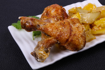 Roasted chicken legs with potato