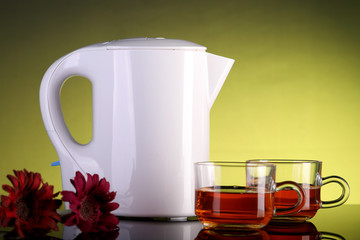 Electric Kettle and Two Tea Cups with Flowers