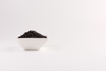 Fototapeta na wymiar bowl of black wild rice isolated on white background