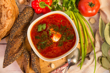 borsch with sour cream and herbs, bread, vegetables, greens, food, top view
