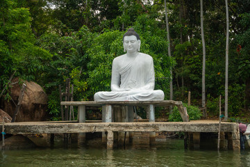 Buddha Statue On The Lake At The Jungle Pier