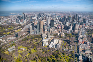 Fototapeta na wymiar MELBOURNE - SEPTEMBER 8, 2018: Aerial city view from helicopter. Melbourne attracts 15 million people annually