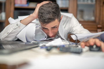 Portrait of a young businessman desperate for his bankruptcy in work