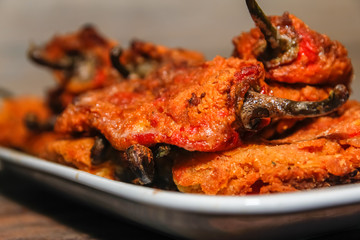Roasted breaded paprika on white ceramic plate