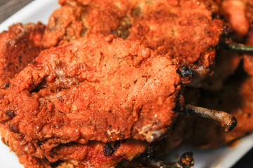 Roasted breaded paprika on white ceramic plate