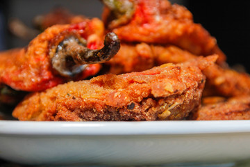Roasted breaded paprika on white ceramic plate