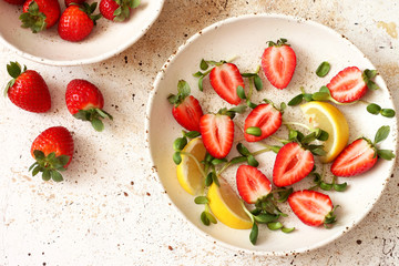 Fresh strawberries in ceramic bowl