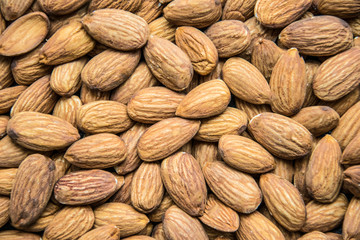 Roasted peeled almond nuts texture ,top view. Almond nuts background