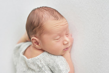 newborn boy on white background