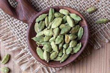 Cardamon seeds on a spoon, top view