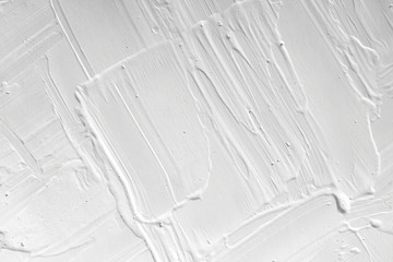 The texture of the paint is white. The background is drawn with a brush with a divorce on the wall.