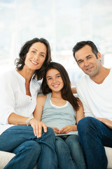 Happy family with one child - daughter with parents - portrait
