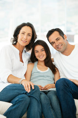 happy family with one child - teenage girl with parents - portrait