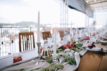 Set tables for wedding dinner  on the roof of the house