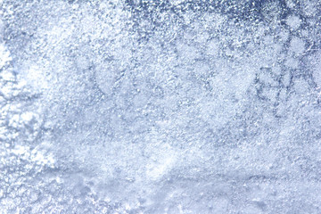 Fototapeta na wymiar Whimsical macro abstract art background of frozen water condensation on a glass window in winter 