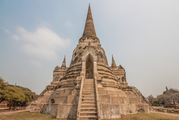 Fototapeta premium Ayutthaya,Thailand - 50 km North of Bangkok, a Unesco World Heritage. Here in particular one of the numerous temples and shrines of the historical park