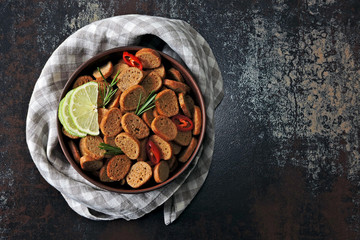 Crispy rye crackers in a bowl with spices. Flat Lay.