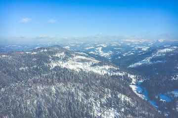 Fototapeta na wymiar Winter scenery in Silesian Beskids mountains. View from above. Landscape photo captured with drone. Poland, Europe.
