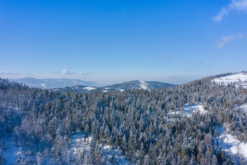 Winter scenery in Silesian Beskids mountains. View from above. Landscape photo captured with drone. Poland, Europe.