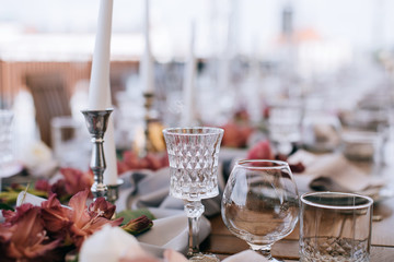 Elegant Wedding table set with pink wlowers and candlesticks 