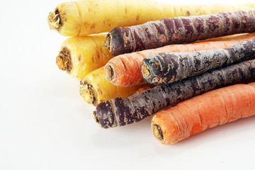 pile of carrots. Crate of mixed fresh harvested colorful carrot.
