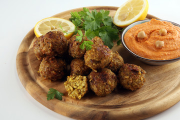 Traditional homemade hummus, falafel and chickpea served with spices on table. Jewish Cuisine.