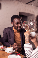 Joyful happy man looking at his sister