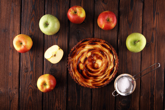 Apple tart. Gourmet traditional holiday apple pie sweet baked dessert food with cinnamon and apples on table