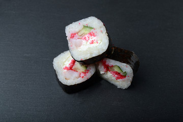traditional fresh japanese sushi on a black background
