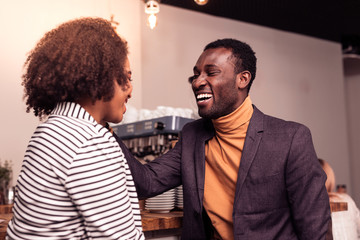 Joyful happy man laughing with his girlfriend