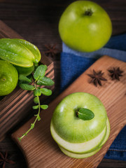 Set of green fruits for healthy diet and detox: apple, lime, kiwi, mango, carambola and mint.