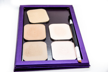 cosmetics for professional makeup on white background