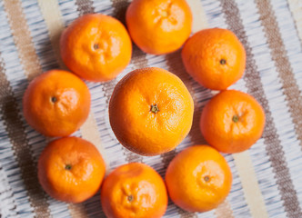 tangerine basket with artisan tablecloth background