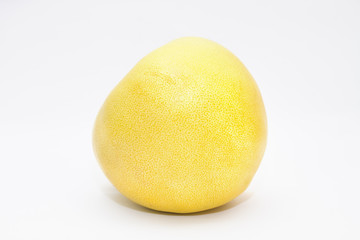Pomelo fruit on gray background. Side view