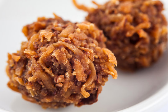 Colombian traditional coconut sweet called cocada in a white ceramic dish