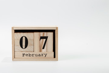 Wooden calendar February 07 on a white background