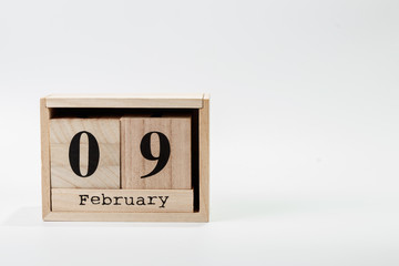 Wooden calendar February 09 on a white background