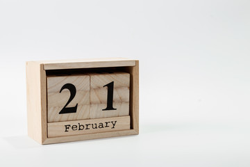 Wooden calendar February 21 on a white background