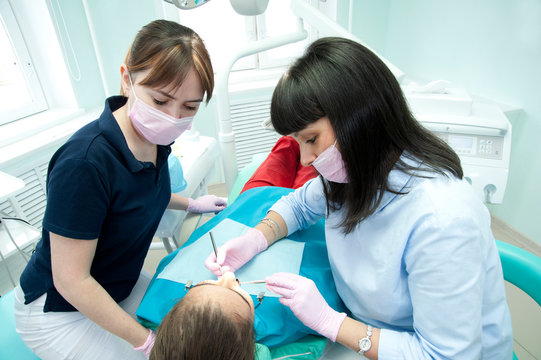 Doctors of the dental surgical department perform a dental surgical operation.