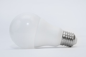 Light bulb on a gray background. Side view
