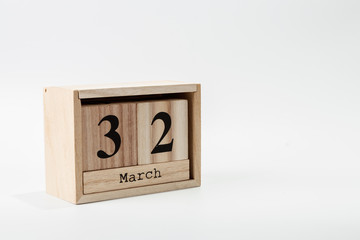 Wooden calendar March 32 on a white background