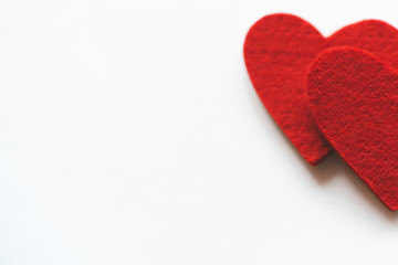 Obraz na płótnie Canvas Red felt hearts on a white background. Valentine's Day