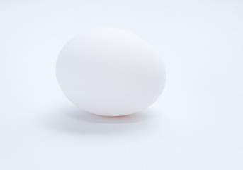 Fototapeta na wymiar Chicken egg on a gray background. Side view